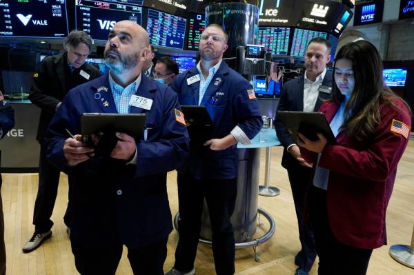 Traders on the floor of the New York Stock Exchange.