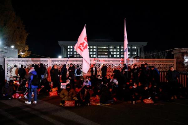 People gather outside the Natio<em></em>nal Assembly in Seoul