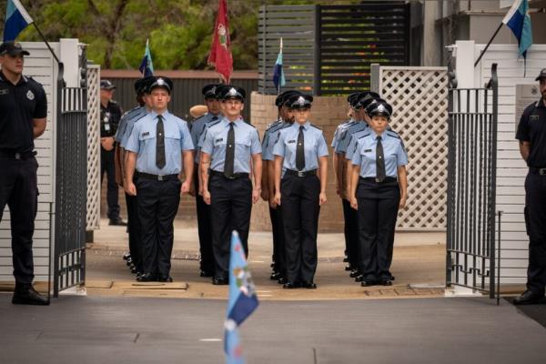 Officers waiting at the gate to march