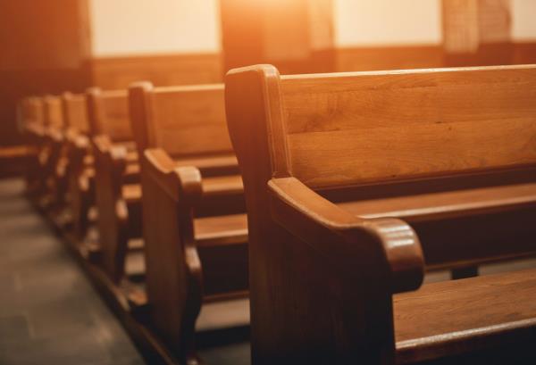 Rows of empty church pews