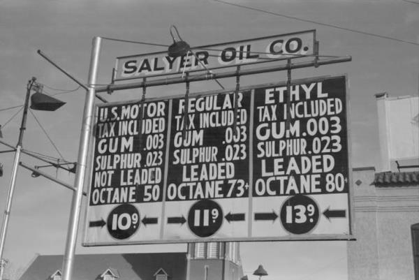 A sign for a gas station in 1940s America, showing leaded petrol on sale.