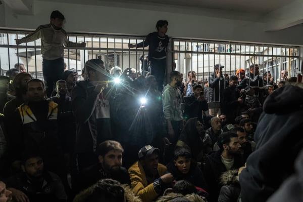 Syrians wait their turn to search for loved o<em></em>nes inside the infamous Sednaya prison, on the outskirts of Damascus, Syria, on Monday. Photograph: Daniel Berehulak/New York Times