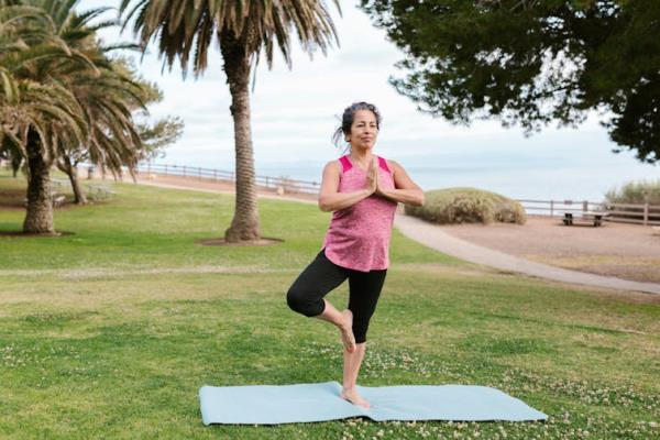 Woman practises yoga