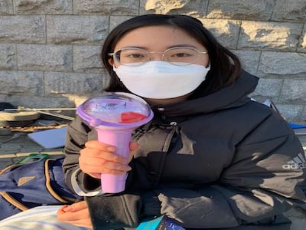 Jane Rhee (22), a student at Seoul Natio<em></em>nal University, holds a torch that many protesters use on demonstrations. Photograph: David McNeill