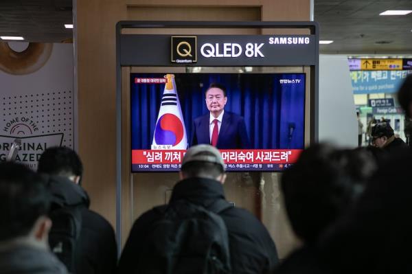 A television screen at Seoul Station shows live footage of South Korean president Yoon Suk Yeol delivering a speech on Saturday. Photograph: Woohae Cho/Bloomberg 