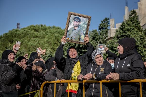 Sally Hayden
4:24 PM, Today
Women mourn the deaths of Hezbollah fighters in Souaneh village on Tuesday.