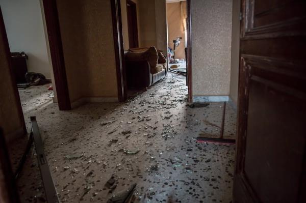 Shattered glass on the floor of Aida Alayan's family home in south Lebanon. Photograph: Sally Hayden. 