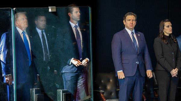 President Do<em></em>nald J. Trump, a secret service member, his son Do<em></em>nald Trump Jr., Florida Governor Ron DeSantis and his wife Casey DeSantis attend a memorial service for three fallen Palm Beach County Sheriff's deputies