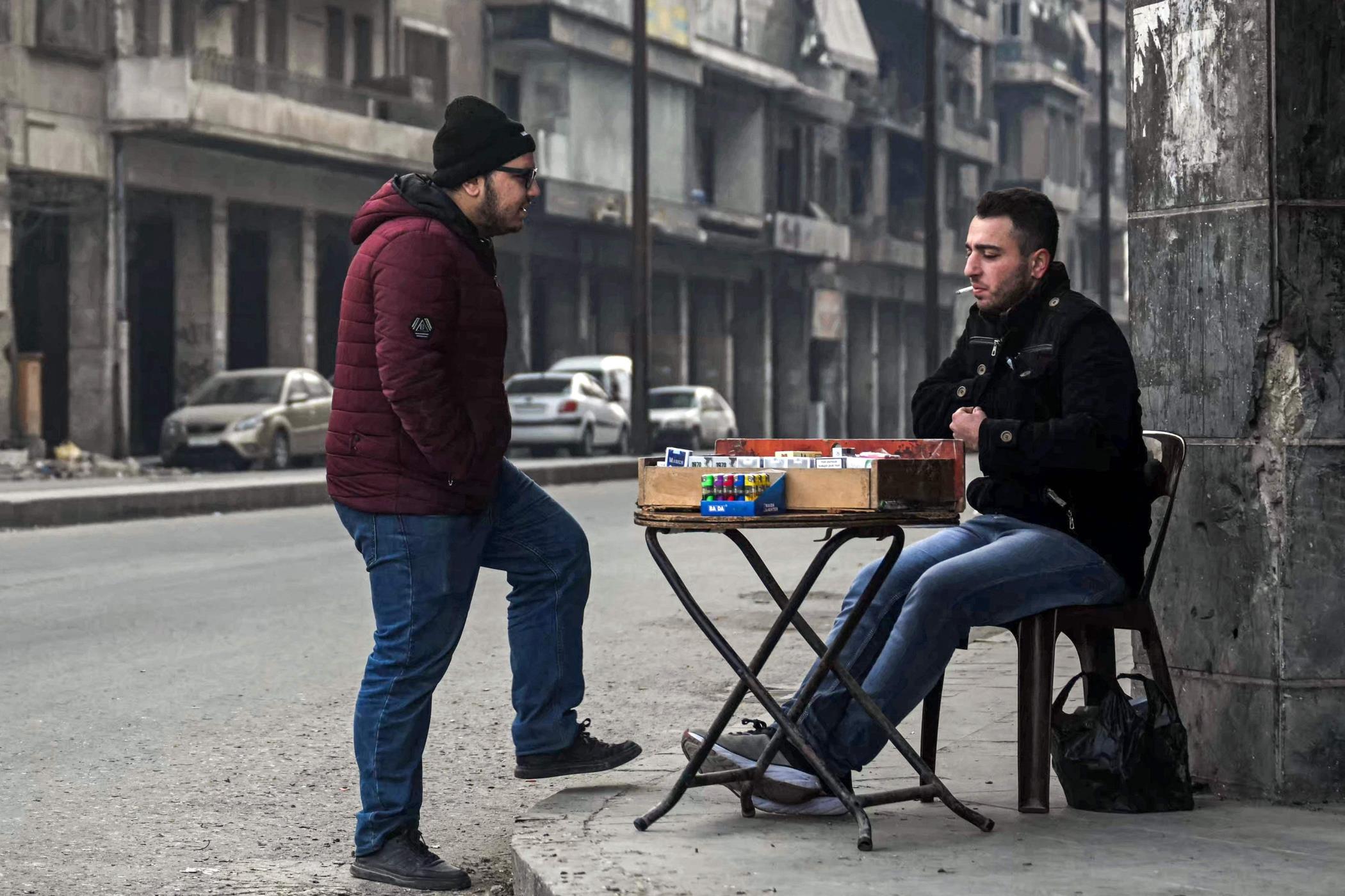 A street vendor sells cigarettes along a corner in northern city of Aleppo, northern Syria, Dec. 11, 2024. (AFP Photo)